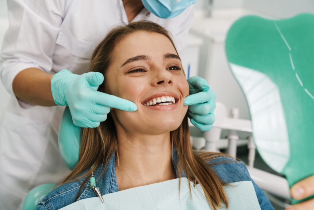 Woman smiling after dentist appointment