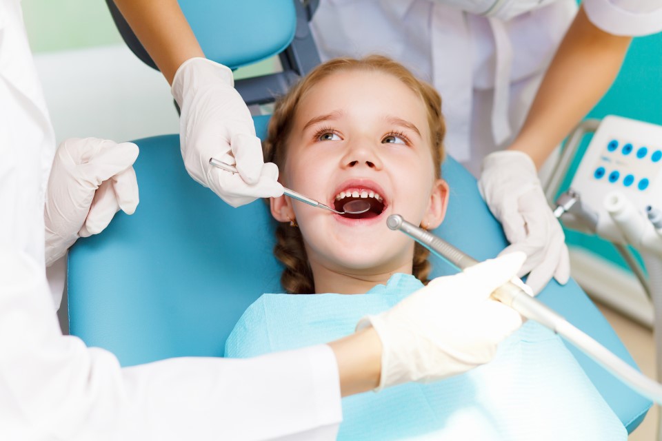 Child having dental work done at dentist